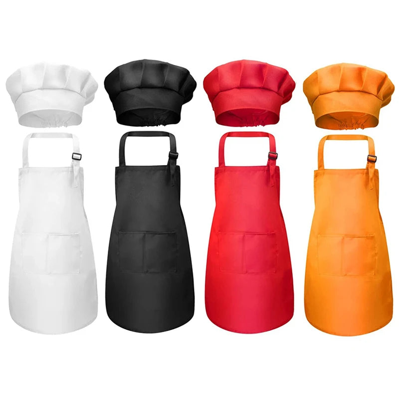 A set of four chef aprons and hats in white, black, red, and orange for kids.