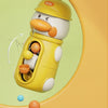 A yellow duck-shaped bath toy with a helmet is shown, featuring suction cup waterwheels and various colored balls.