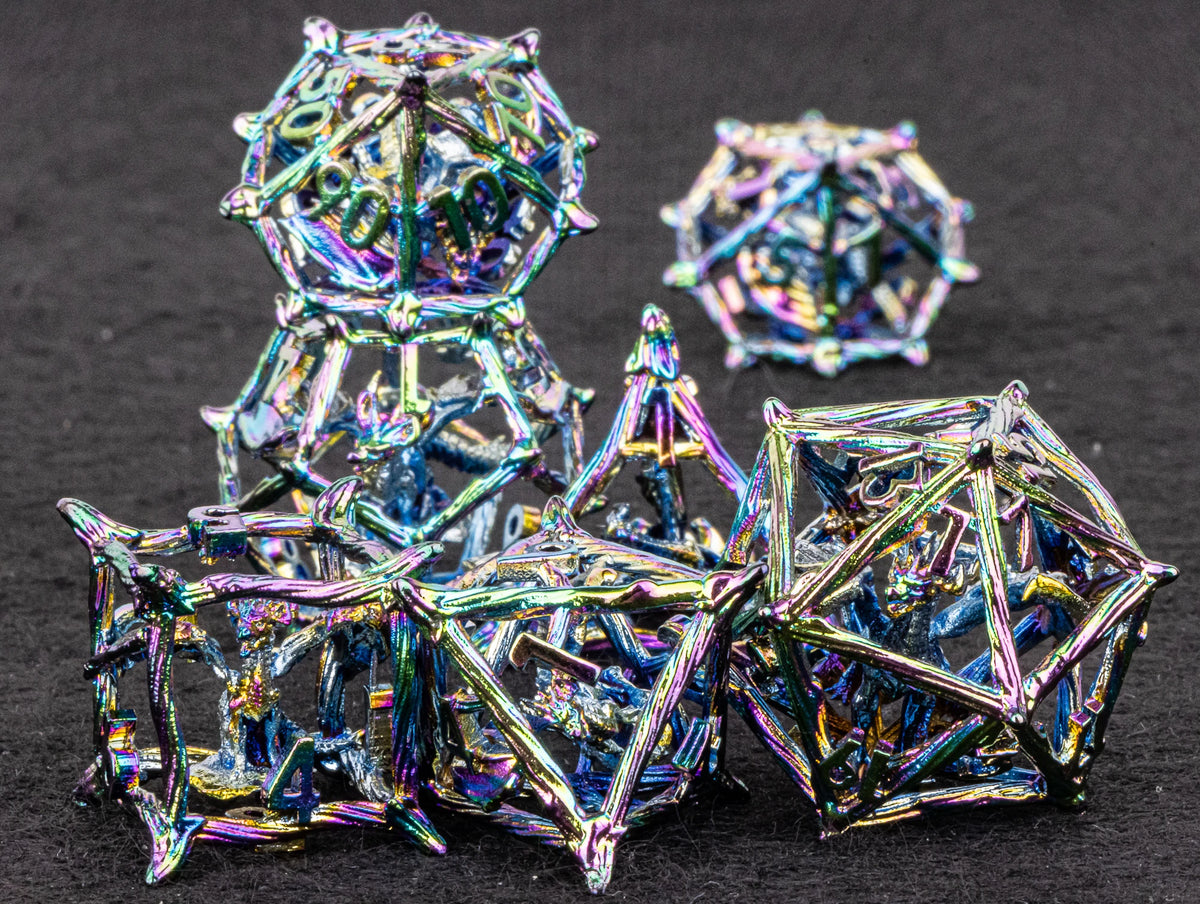 A set of intricate, iridescent metal dice shaped like blood dragons for tabletop role-playing games