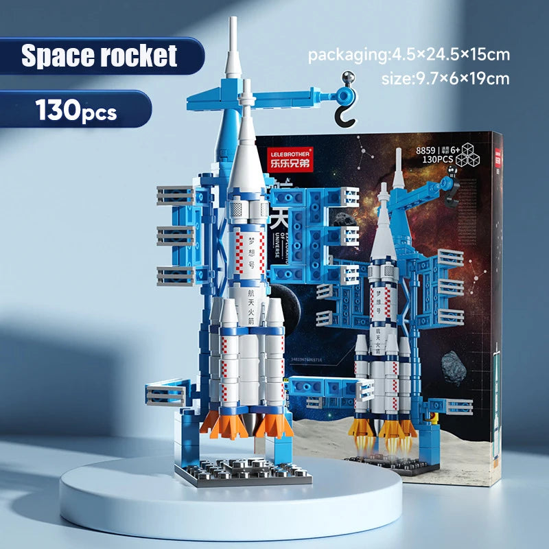 A blue and white space rocket building block set featuring a helicopter and carrier vehicle model.