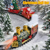 A festive Christmas train set featuring a green locomotive, Santa, and a snowman moving through a snowy winter landscape.