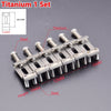 A set of titanium guitar bridge saddles and mounting hardware for electric guitars.