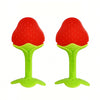 A pair of red, fruit-shaped silicone baby teethers with bright green bases.