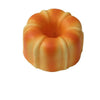 A realistic bread squeeze toy with a golden-brown, textured surface.