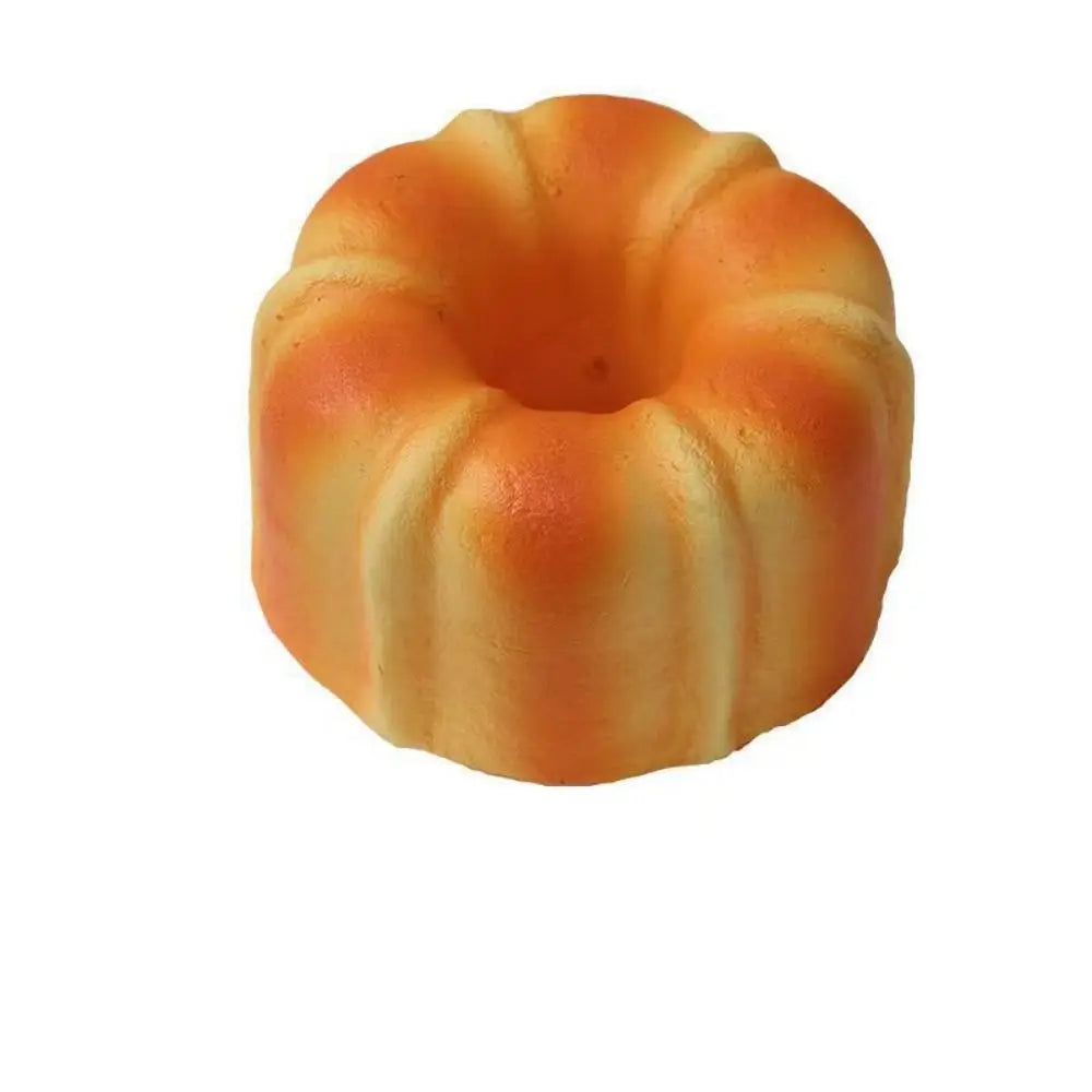 A realistic bread squeeze toy with a golden-brown, textured surface.