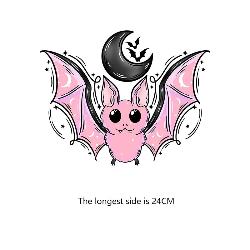A cute pink bat design with black wings and a crescent moon silhouette.