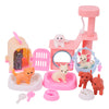 A pink mini dollhouse set with accessories including a pink building, a pink toilet, and various medical tools for dolls.