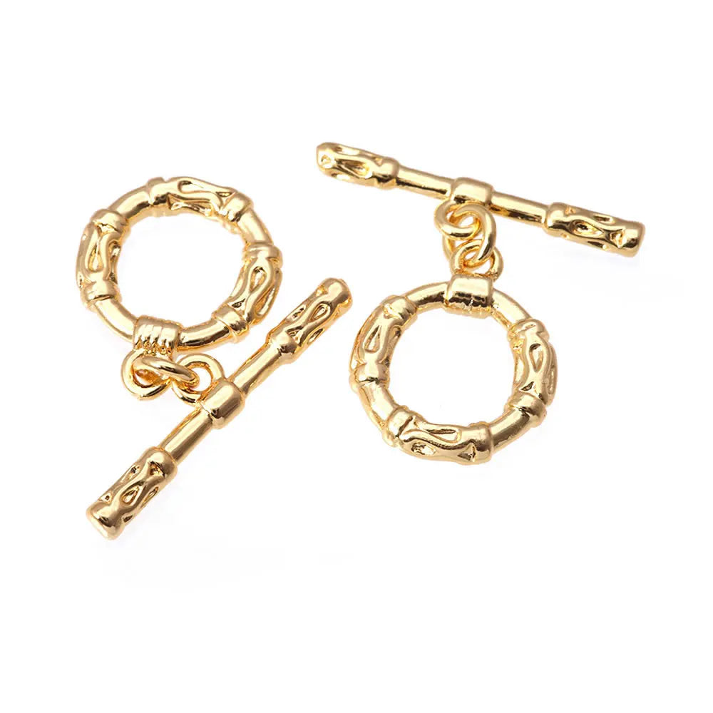 A pair of 18K gold round O-toggle clasps for bracelets and jewelry making.