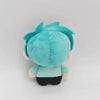A plush doll of an anime alien with bright turquoise blue hair and skin, viewed from the back.
