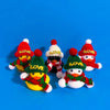 A set of mini rubber duck accessories including hats and sunglasses displayed against a blue background.