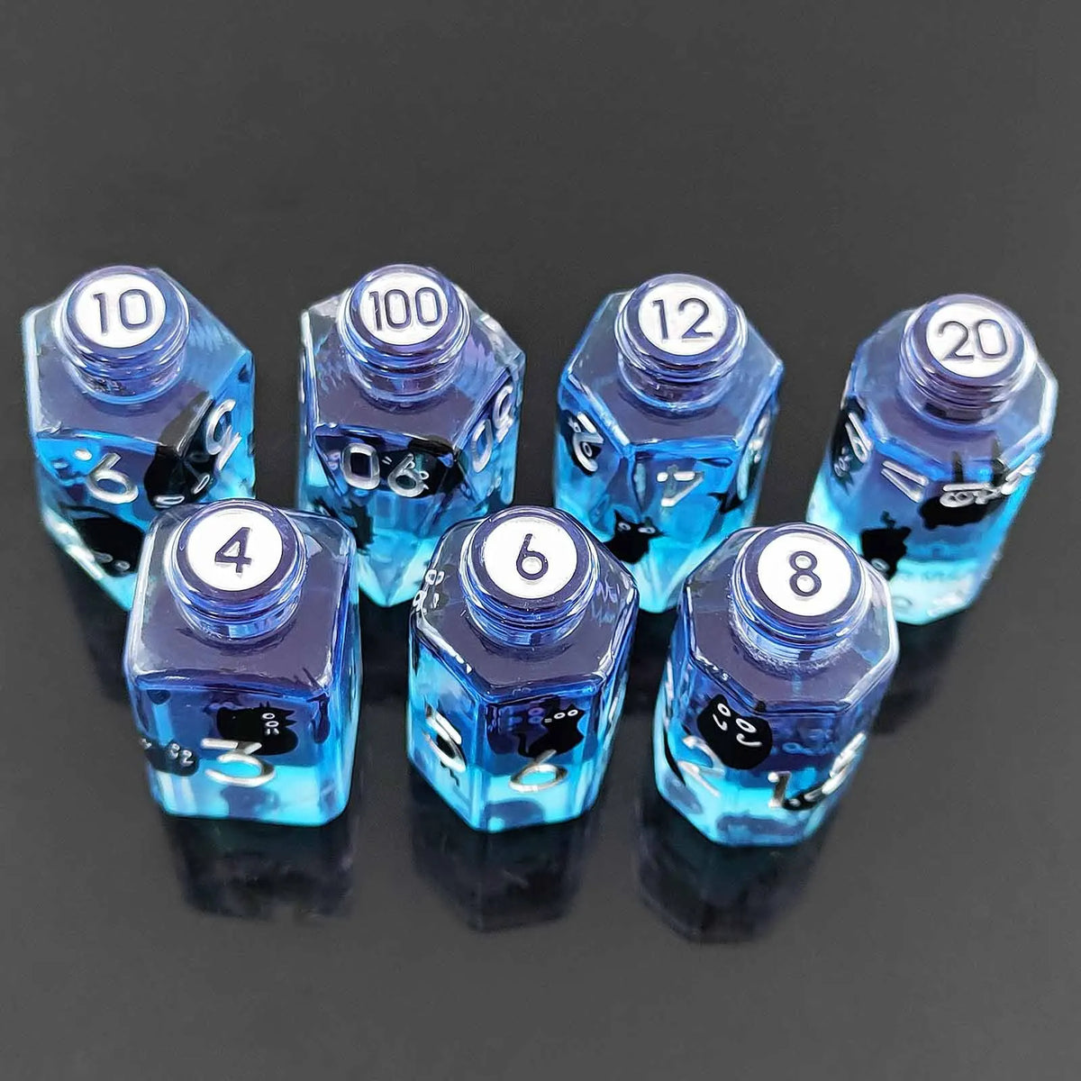 A set of seven floral resin potion bottle polyhedral dice numbered 4, 6, 8, 10, 12, 100, and 20.