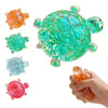 A collection of colorful squishy star turtle stress relief fidget balls, including orange, green, blue, and pink varieties.