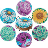 A set of seven colorful mandala flower coasters made from 5D diamond painting beads.