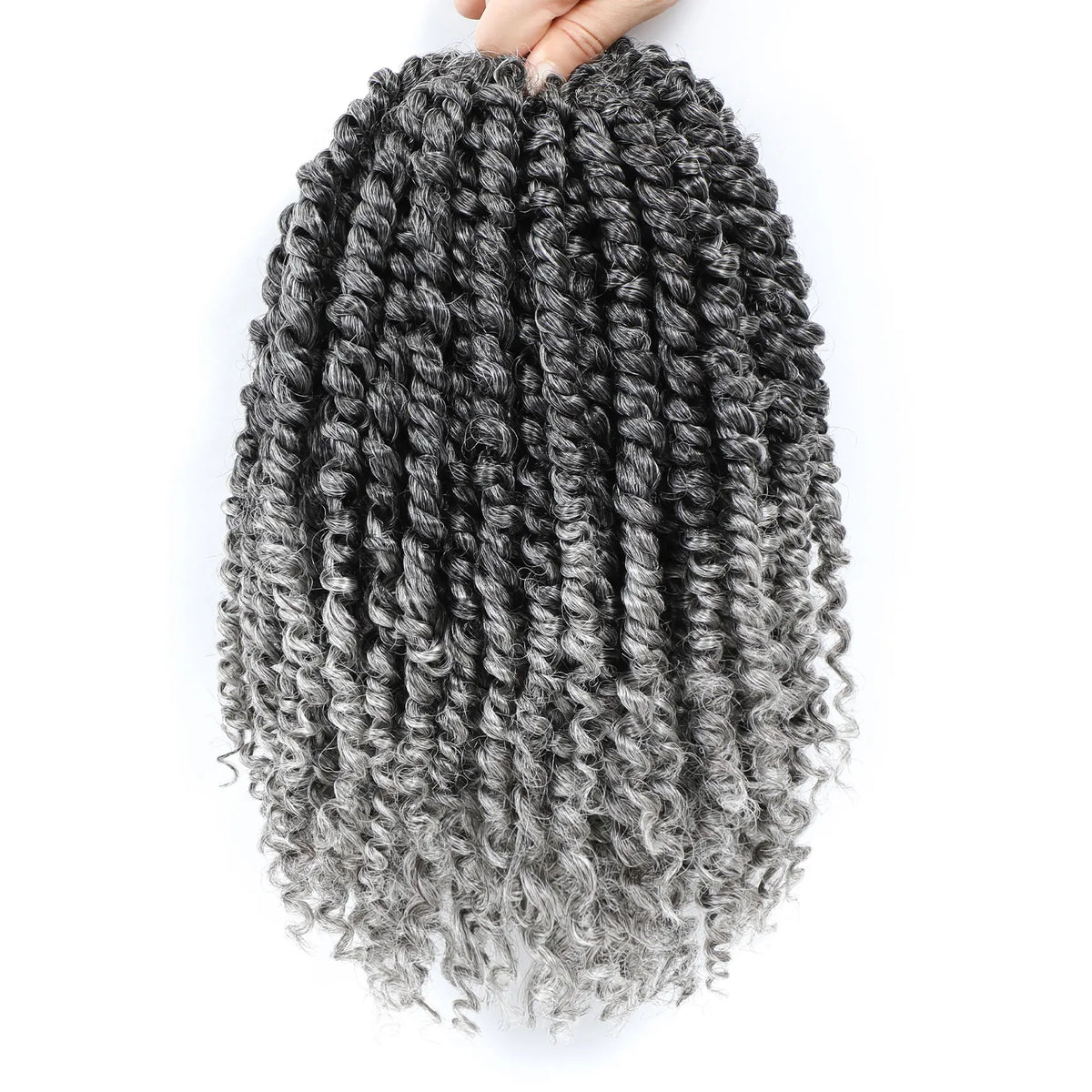 A bundle of pre-looped passion twist crochet hair in black and gray is held by a hand.