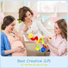 A mother and baby are shown interacting with a soft plush hanging toy for baby-to-be.