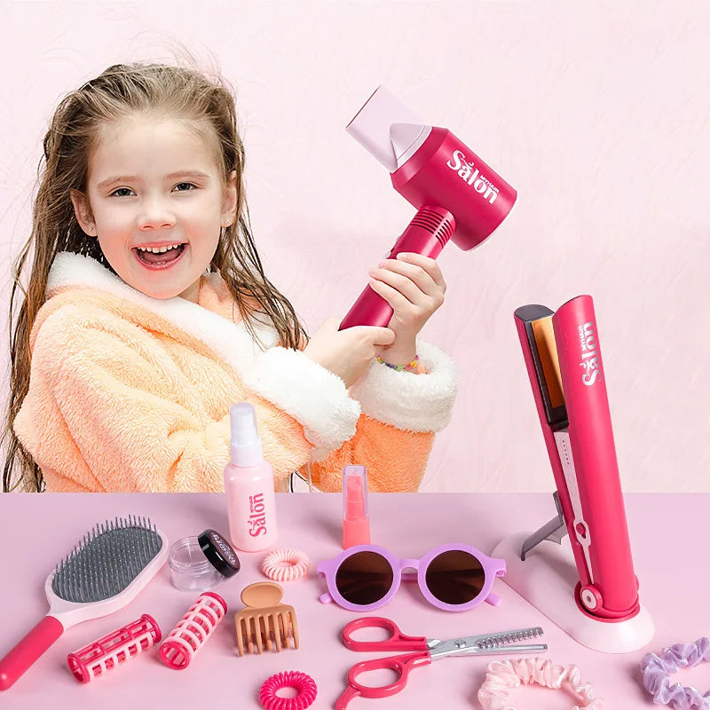 A pink hair styling set for kids featuring a hairdryer, brushes, combs, scissors, and accessories.