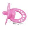 Pink doll feeding and care accessory set featuring a pink plastic ring and feeding tool.