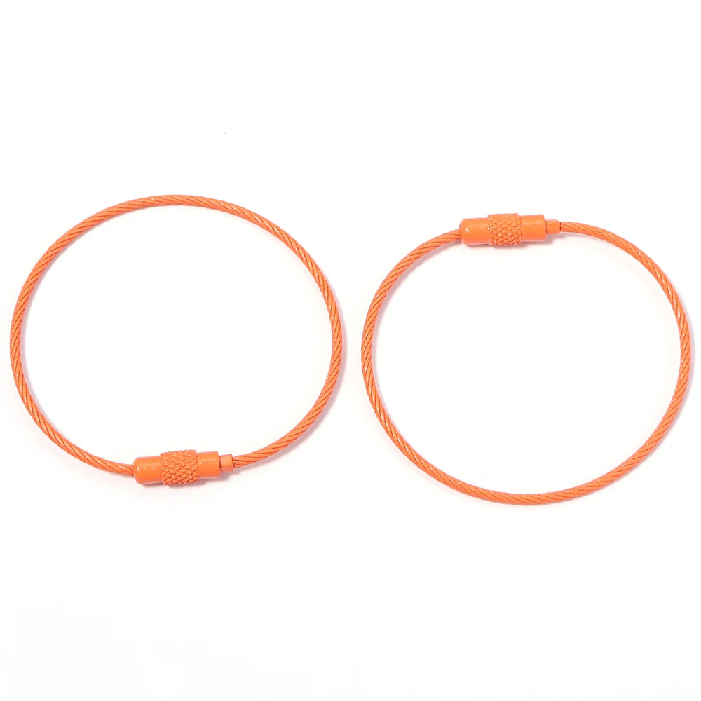 A set of orange stainless steel wire keychain rings with screw locks.