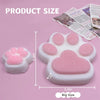 A pink squishy toy shaped like a cat paw, shown next to a printed size guide.