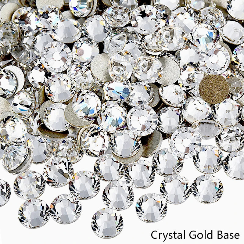 A close-up view of sparkling crystal gold base rhinestones for nail art and crafts.