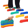 Colorful rainbow sensory stepping stones arranged in a stack and scattered, used for balance play.