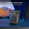 Amplificateur de guitare électrique portable noir avec réglages de volume et de tonalité sur une surface bleue.