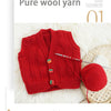 A bright red knitted sweater made from pure wool yarn displayed next to a ball of the same yarn.