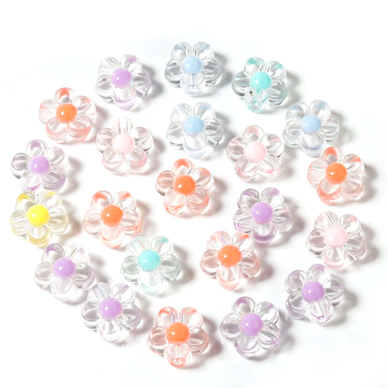 A collection of colorful transparent acrylic flower beads in various shades of pink, purple, and orange.