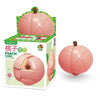 A pink fruit-shaped puzzle cube with a pumpkin design is shown in its packaging.