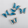 A set of sparkling blue crystal butterfly charm beads for jewelry making