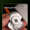 A hand holds a silver magnetic fidget spinner with push buttons, demonstrating its compact and portable design.