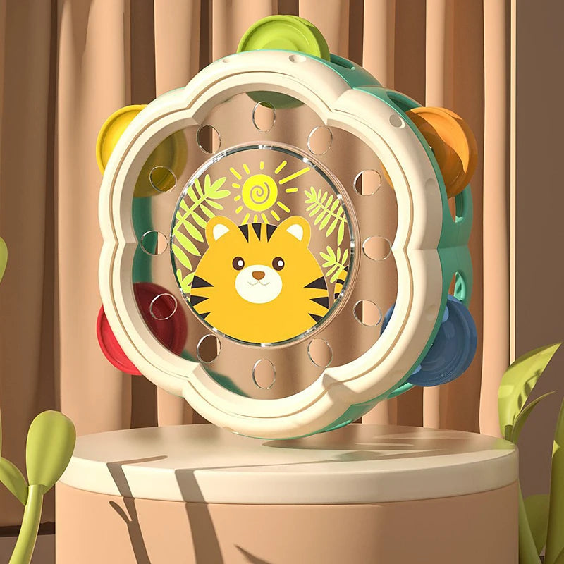 A colorful baby musical instrument set featuring a hand drum and shake rattle designed for toddlers.