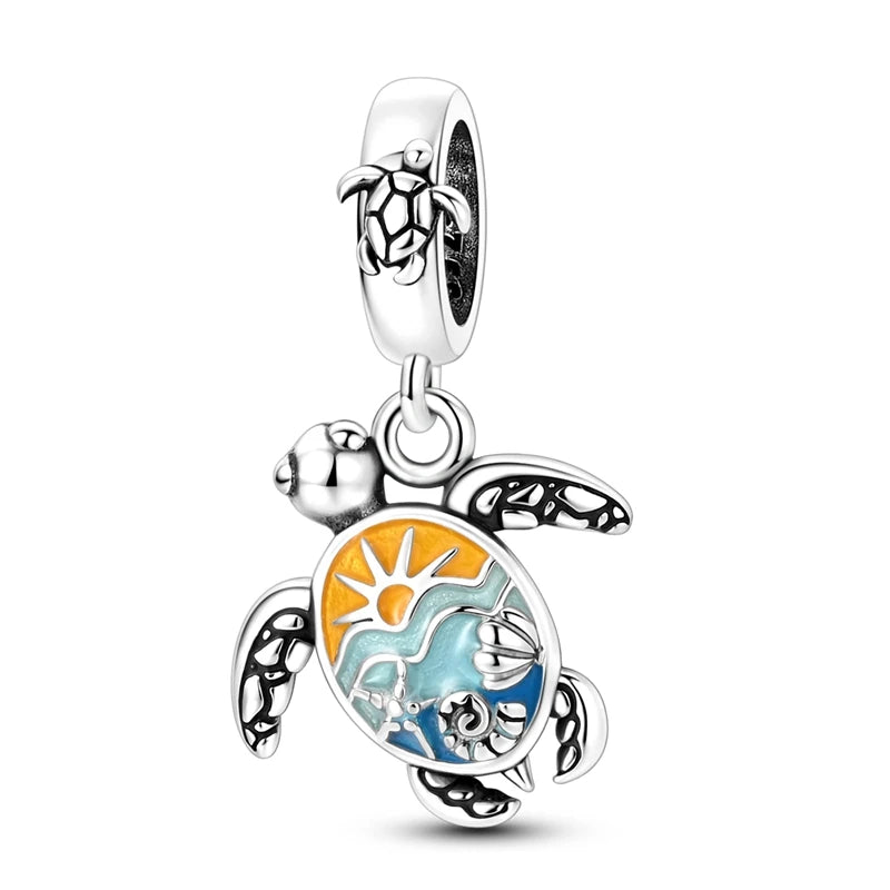Sterling silver charm pendant set featuring a starfish, sea turtle, and whale shark.
