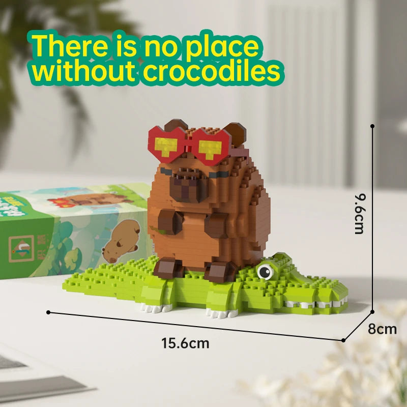 A brown capybara building block model with red goggles sits on a green base.
