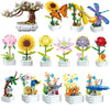 A set of building blocks depicting various flowers and plants, including roses, sunflowers, and other colorful blooms.