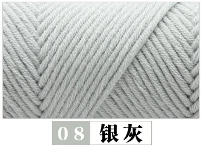 A close-up of a gray knitted yarn, labeled as Silver, showing the texture and twist of the fiber.
