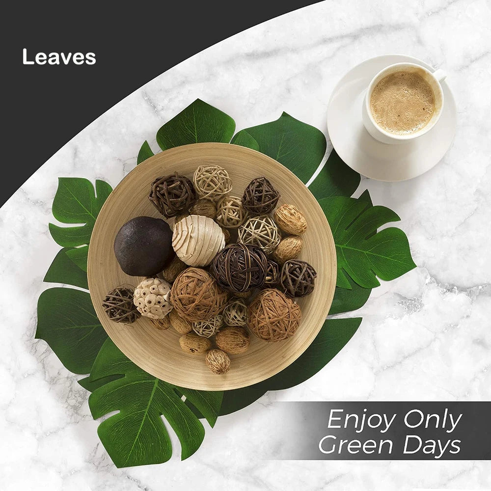 A bowl filled with various natural-looking brown and beige decorative leaves and spherical elements on a white marble surface