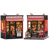 A miniature 3D wooden book nook kit of a pizzeria storefront with LED lighting.