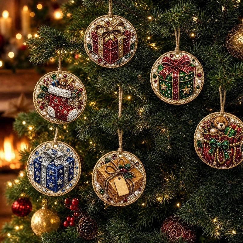 A close-up of various handmade Christmas diamond painting ornaments hanging on a green fir tree.