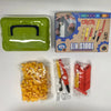 A green plastic tool kit box and a clear plastic bag containing yellow cardboard tools and screwdrivers.
