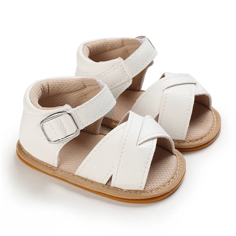 Pair of beige breathable baby first walker sandals with soft anti-slip soles
