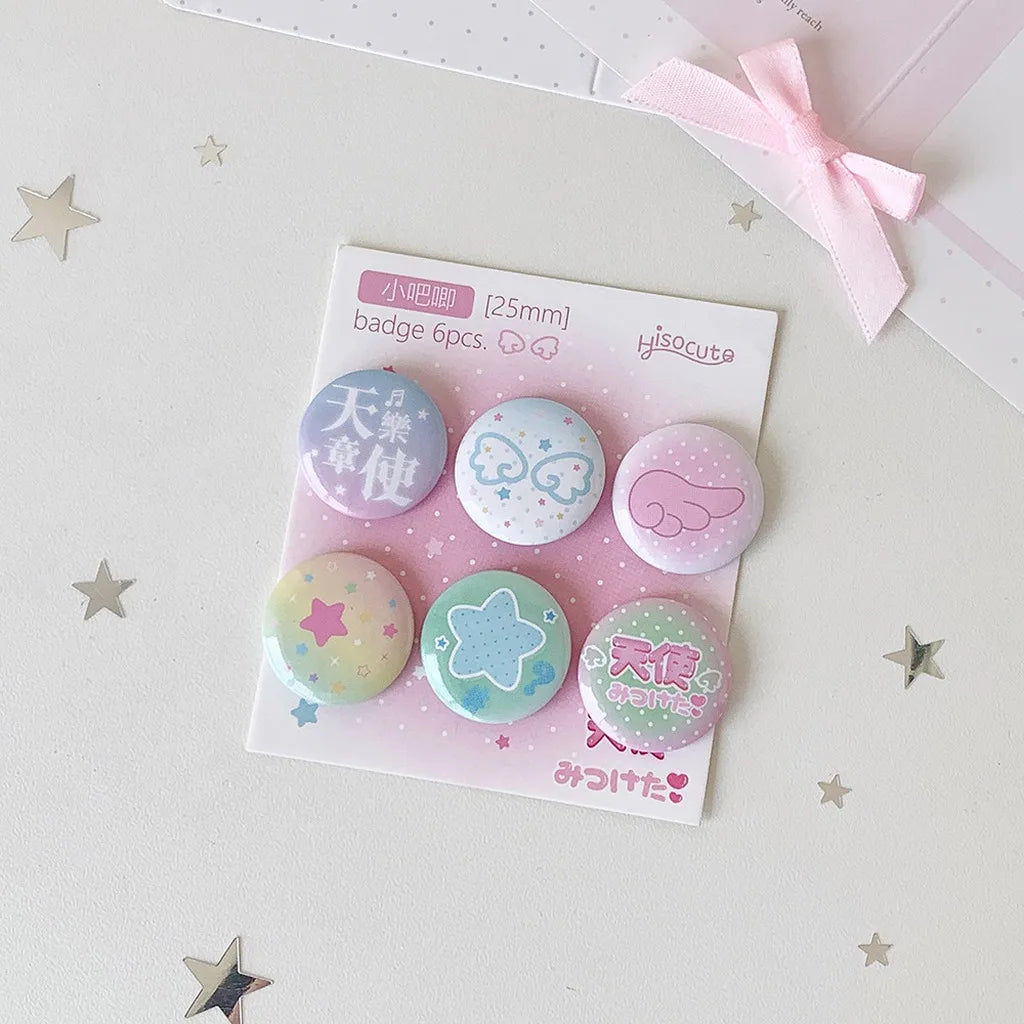 A set of six pink and white mini pin badges featuring celestial themes like stars and clouds.