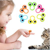 A child's finger is pointing at a set of ten colorful rubber finger puppets for kids.