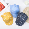 Three baby cotton baseball caps in blue and yellow with rabbit ears displayed on a white background.
