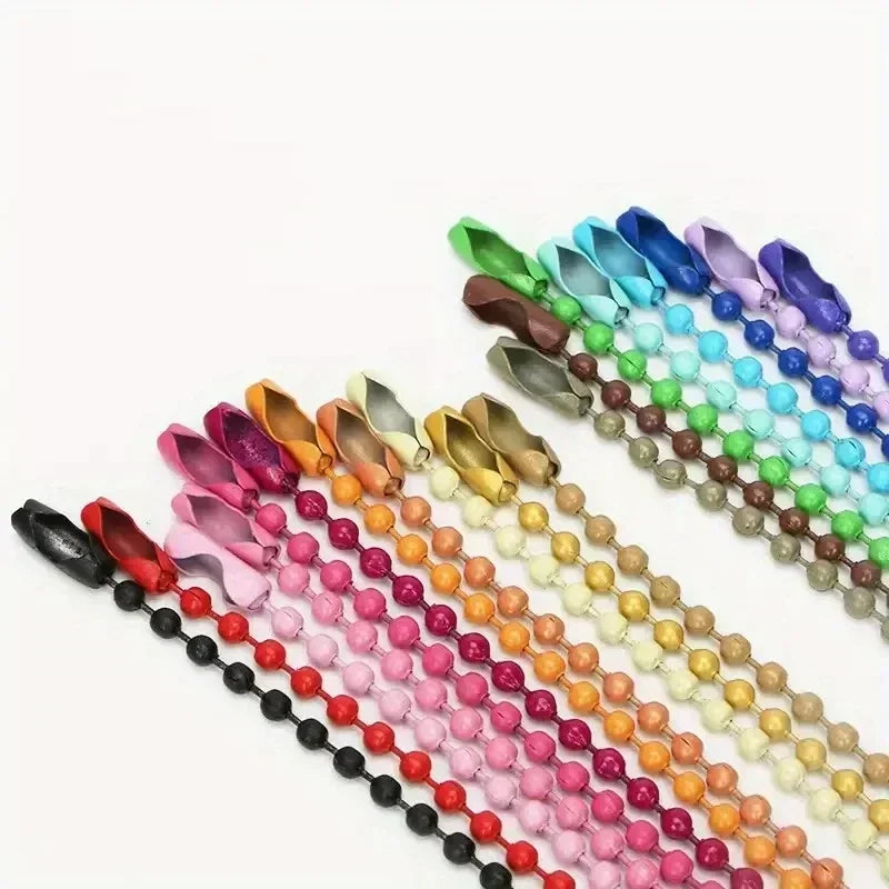 A collection of colorful ball bead chains in various shades of blue, green, purple, pink, and orange.