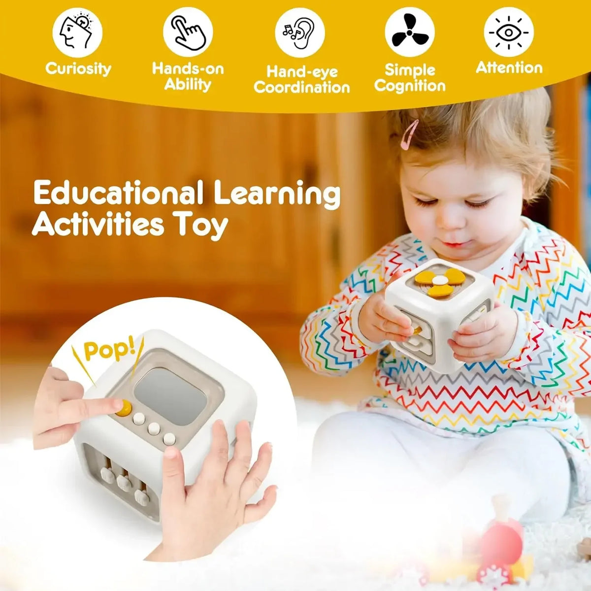 A toddler is playing with a white sensory cube toy while learning curiosity, hand-on ability, coordination, and attention ski