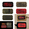 A collection of tactical reflective hook-and-loop patches featuring the text HELL ADMIT ONE and POUND TOWN on various colored