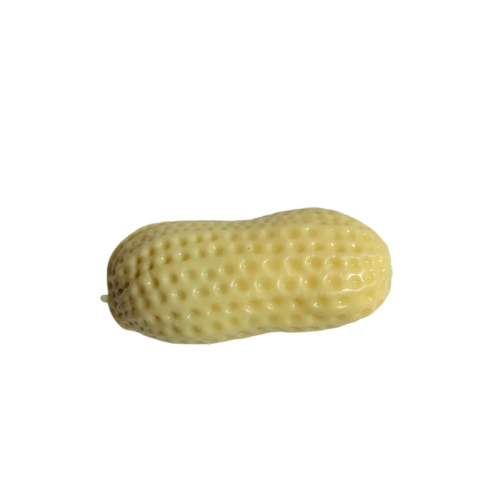A light yellow, elongated peanut-shaped squishy stress ball with a textured surface.