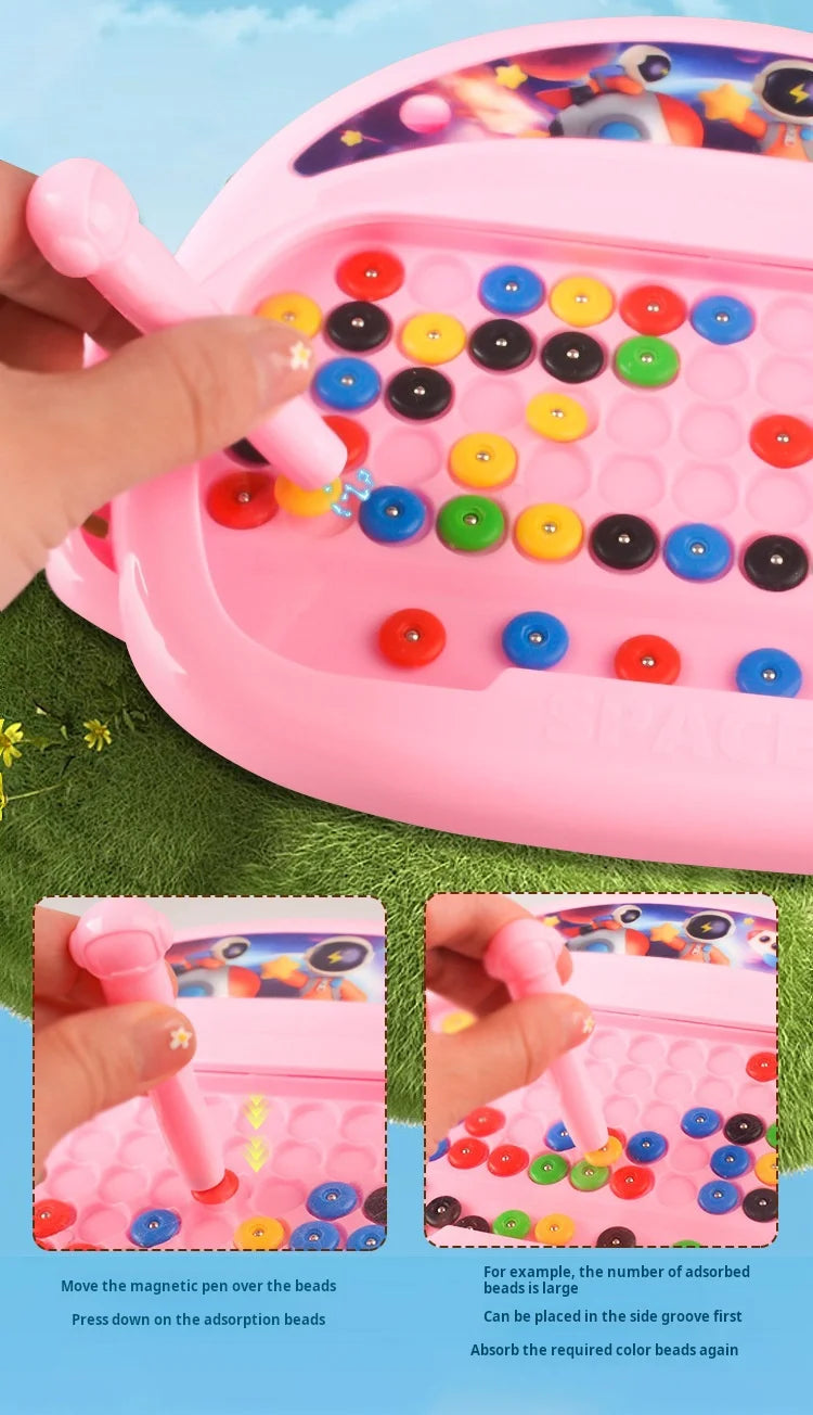 A pink magnetic doodle board for kids showing a hand pressing beads onto a surface.
