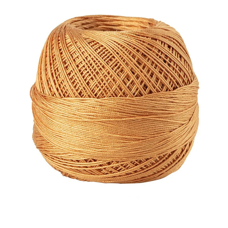 A ball of natural tan crochet thread used for tatting and embroidery.